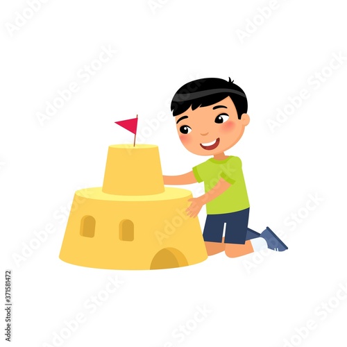 Cute child building sand castle flat vector illustration. Funny kid playing on beach cartoon character. Asian boy constructing sandy fortress isolated on white background. Summer recreation activity