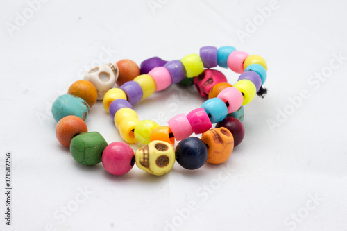 Mexican skull bracelet and multicolored bracelet.