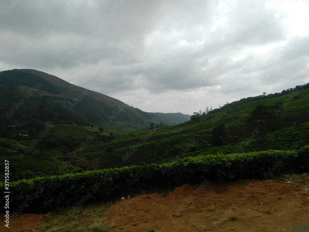 blend of hills clouds and greenery blend of hills clouds and greenery