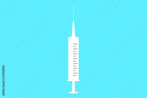 syringe with needle on light blue background