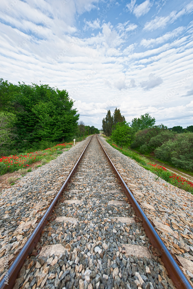 Fototapeta premium Rusty steel and wood train tracks in the Extremadura countryside