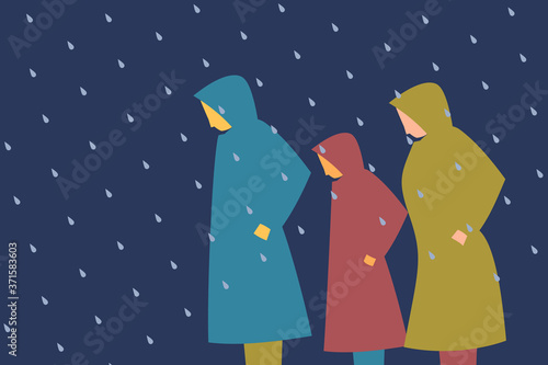 People wearing raincoats walk out in the rain