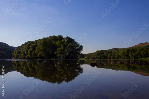 Very beautiful river water surface. Natural green background. photo