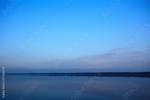 abstract sunset on the lake  landscape water and sky  blurred view freedom nature concept