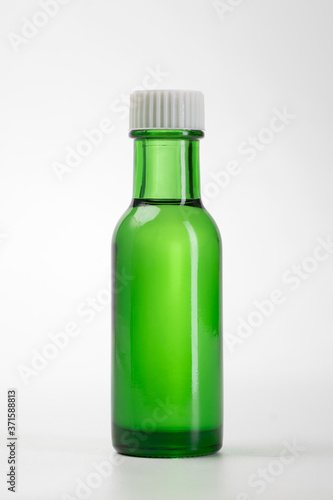 essential oil bottle. Mock up bottle cosmetic or medical vial, flask real photo