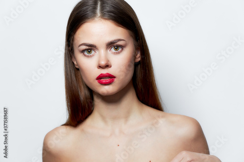 Brunette Naked shoulders red lips look forward clear skin spa treatments 