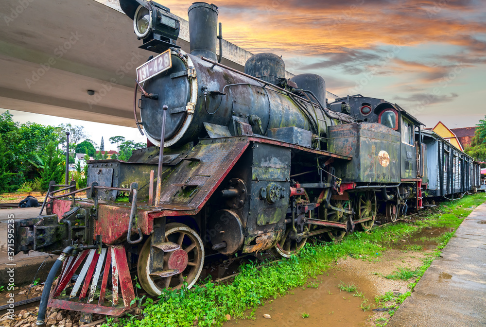 Naklejka premium Old locomotive in the station, history destination for traveler, this is oldest platform from 19th century still preserved to this day in Da Lat, Vietnam