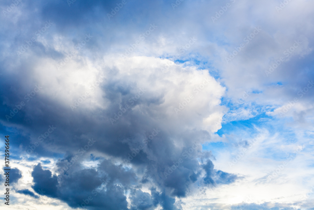 large dark rainy cloud in cloudy blue sky on summer day large dark rainy cloud in cloudy blue sky on summer day