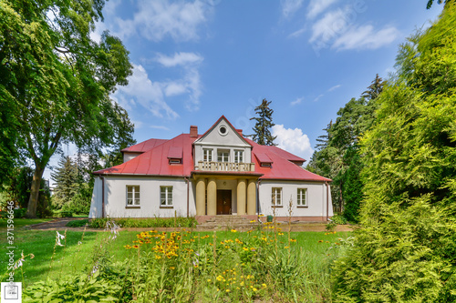 Historic manor in Sedziejowice, Poland surrounded by an old park.