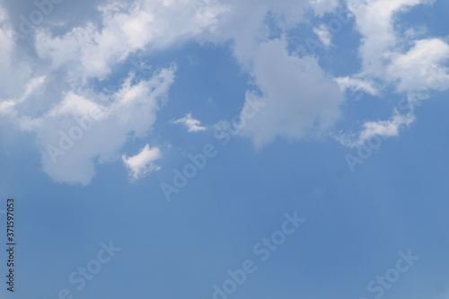 White clouds against blue sky background