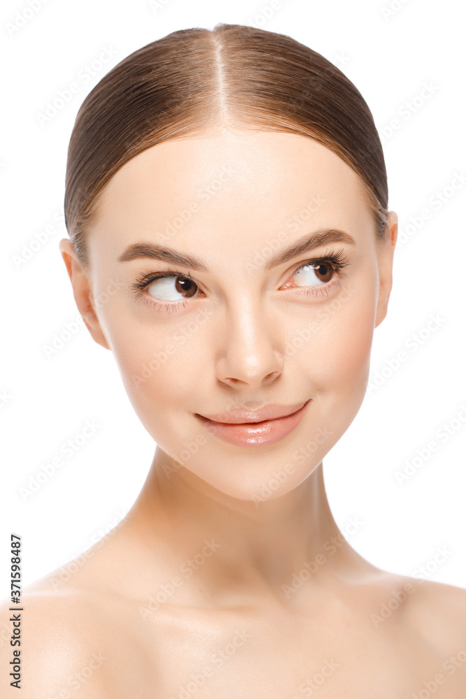 Close-up vertical portrait of young beautiful woman with light glowing skin, looking aside, isolated on white background. Female skincare beauty concept Close-up vertical portrait of young beautiful woman with light glowing skin, looking aside, isolated on white background. Female skincare beauty concept