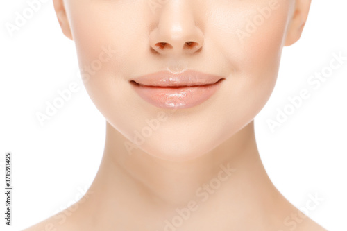 Close-up photo of young anonymous female with beautiful glowing face and neck skin, isolated on white background. Woman skincare concept