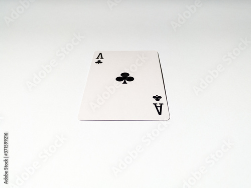 A close up view at one ace card with a club suit from a deck of playing cards. The concept of games, gambling, fun and free time.