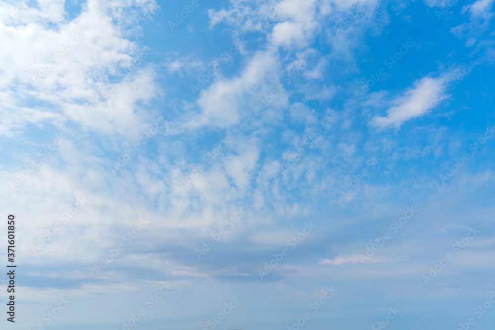 White clouds in the blue sky. Atmospheric natural background. White clouds in the blue sky. Atmospheric natural background.