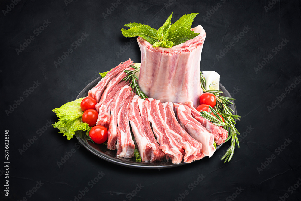 Fresh and raw meat. Ribs and pork chops uncooked, ready to grill and barbecue Fresh and raw meat. Ribs and pork chops uncooked, ready to grill and barbecue
