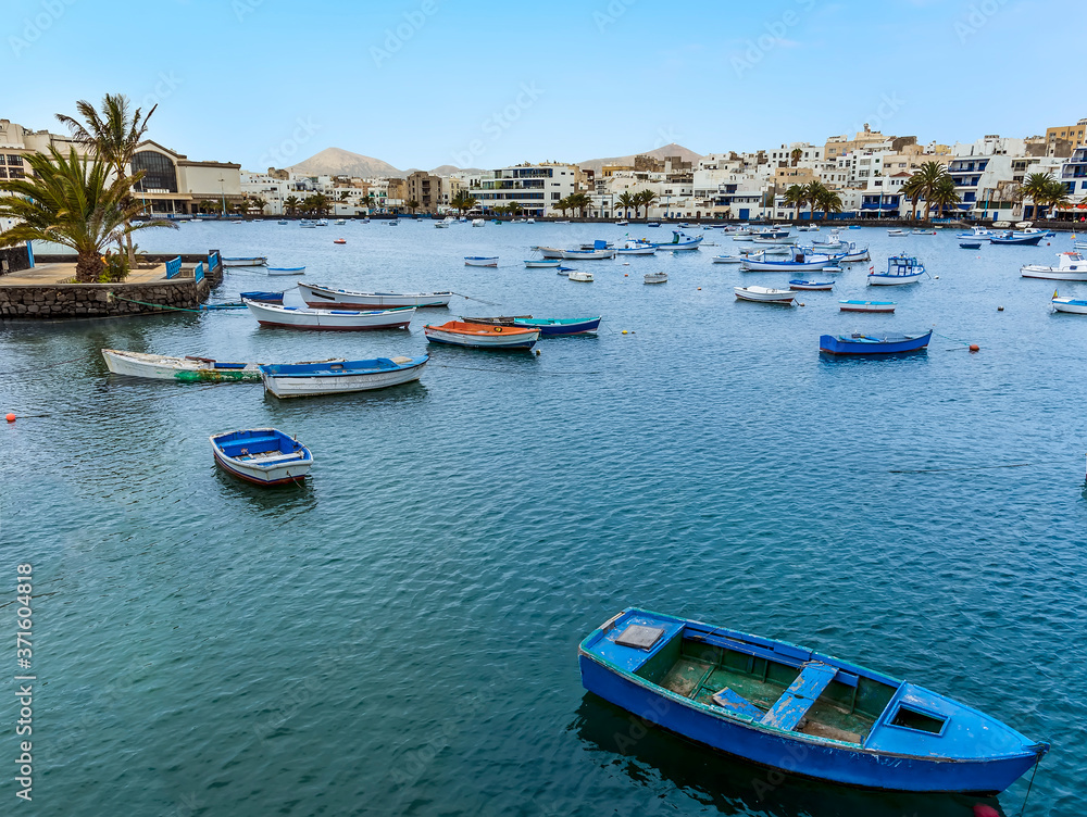 A view across the boats moored in the lagoon of Charco de San Gines in Arrecife, Lanzarote on a sunny afternoon