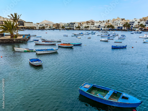 A view across the boats moored in the lagoon of Charco de San Gines in Arrecife, Lanzarote on a sunny afternoon