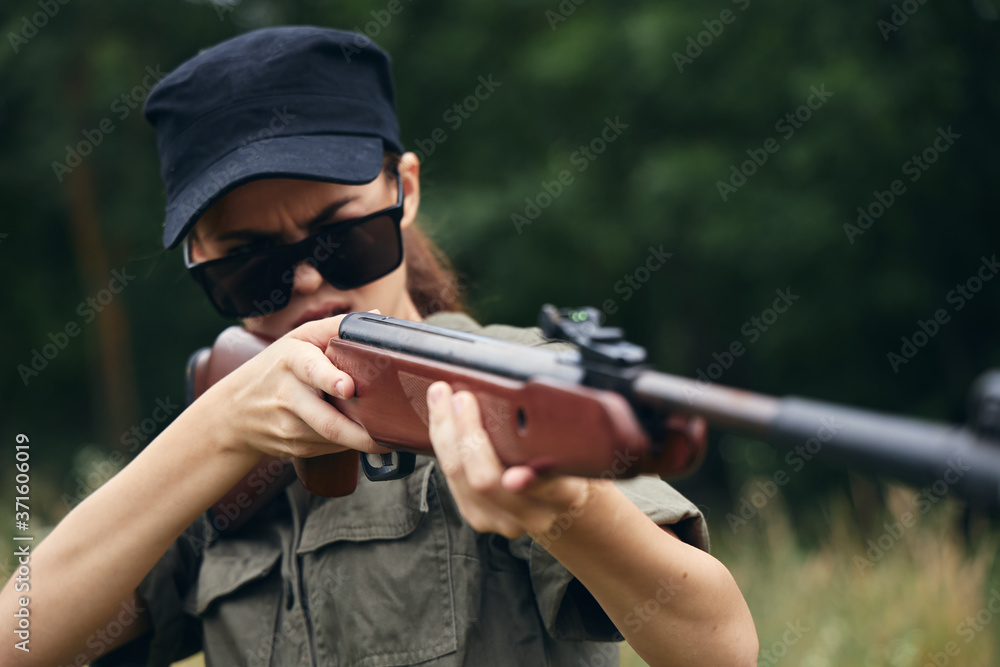 Military woman With weapons in hand, hunting target sunglasses weapons Military woman With weapons in hand, hunting target sunglasses weapons