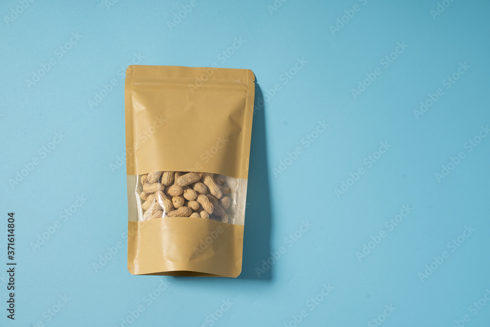 peanut snack on a blank standing pouch mockup with transparent window peanut snack on a blank standing pouch mockup with transparent window