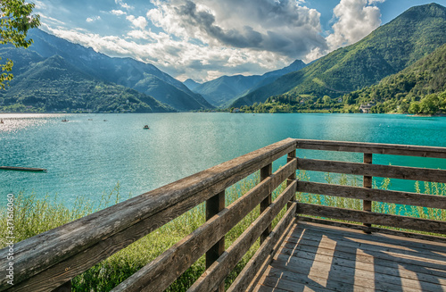 Ledro, Italy. The Ledro lake and Its beaches. A natural alpine lake. Amazing turquoise, green and blue colors. Ledro Valley, Trentino Alto Adige, Italy