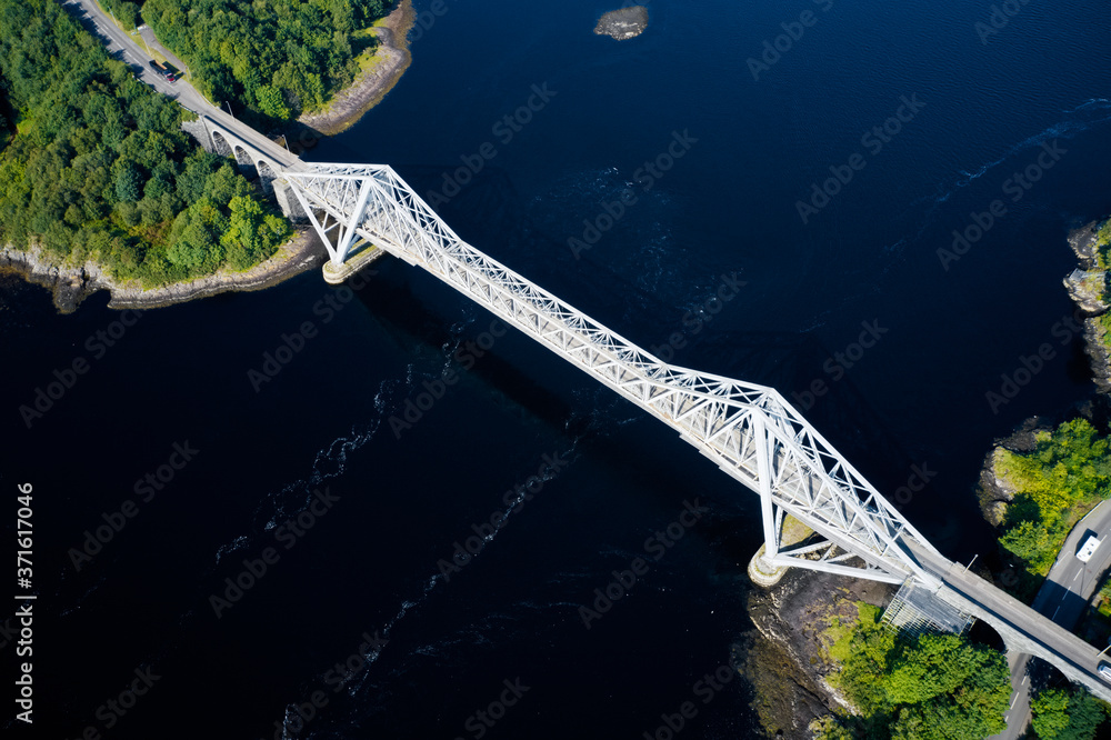 Fototapeta premium Connel Bridge steel cantilever structure ocean sea road crossing over Loch Etive in Argyll and Bute Scotland