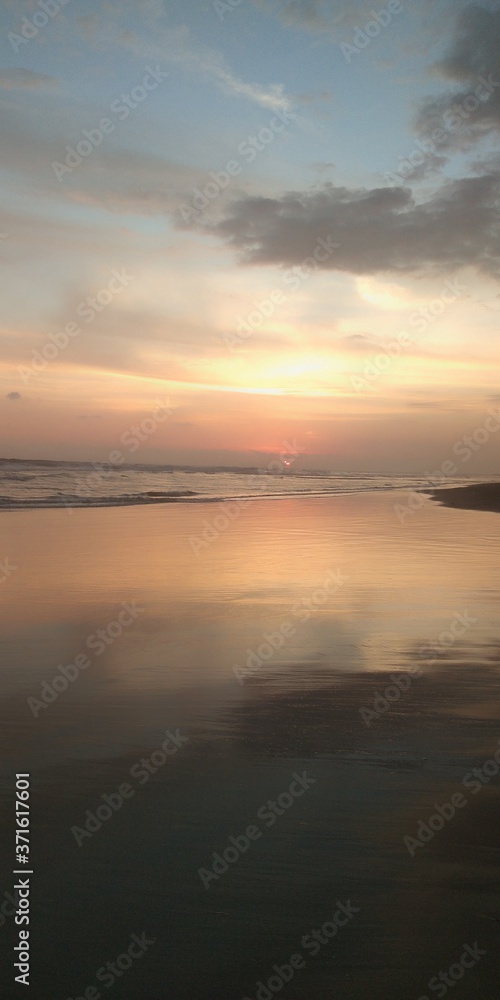 sunset over the sea on the Long Beach of Bengkulu, Indonesia