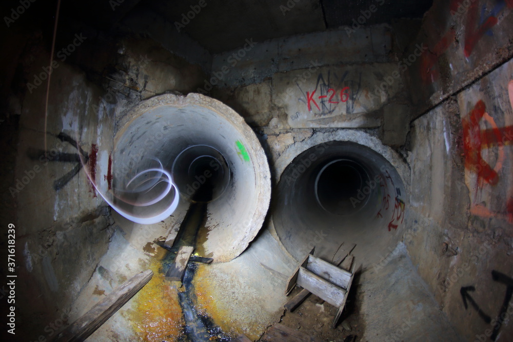 inside the sewer pipes in the city