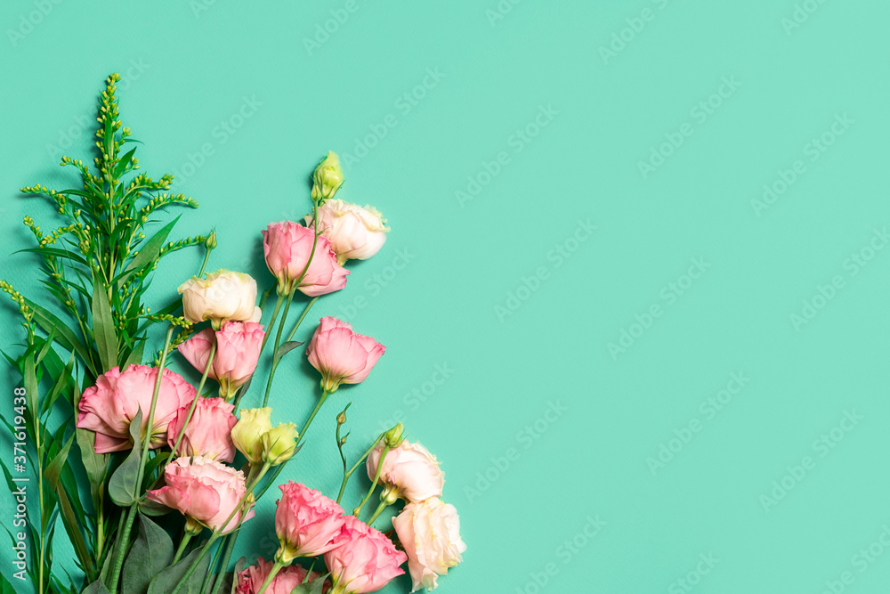 Fototapeta premium Floral composition with pastel pink roses on light green background with copy space