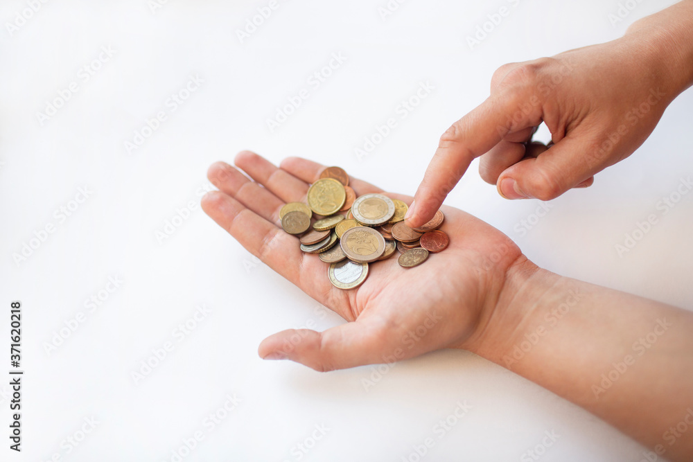 some small coins on the hand some small coins on the hand