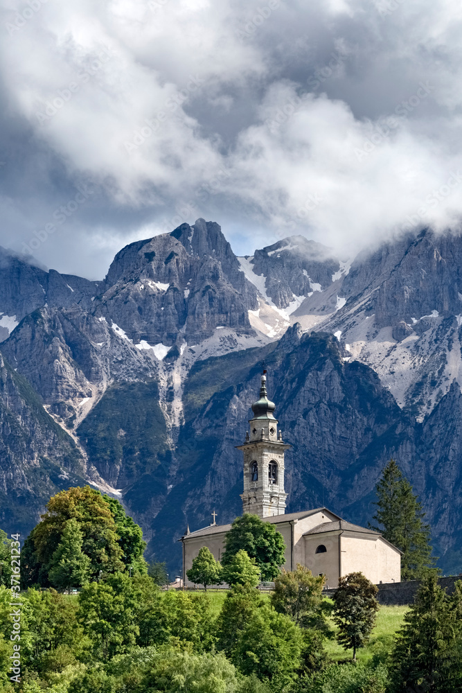 The village of Parrocchia and in the background Mount Carega of the Piccole Dolomiti. Vallarsa, Trento province, Trentino Alto-Adige, Italy, Europe.