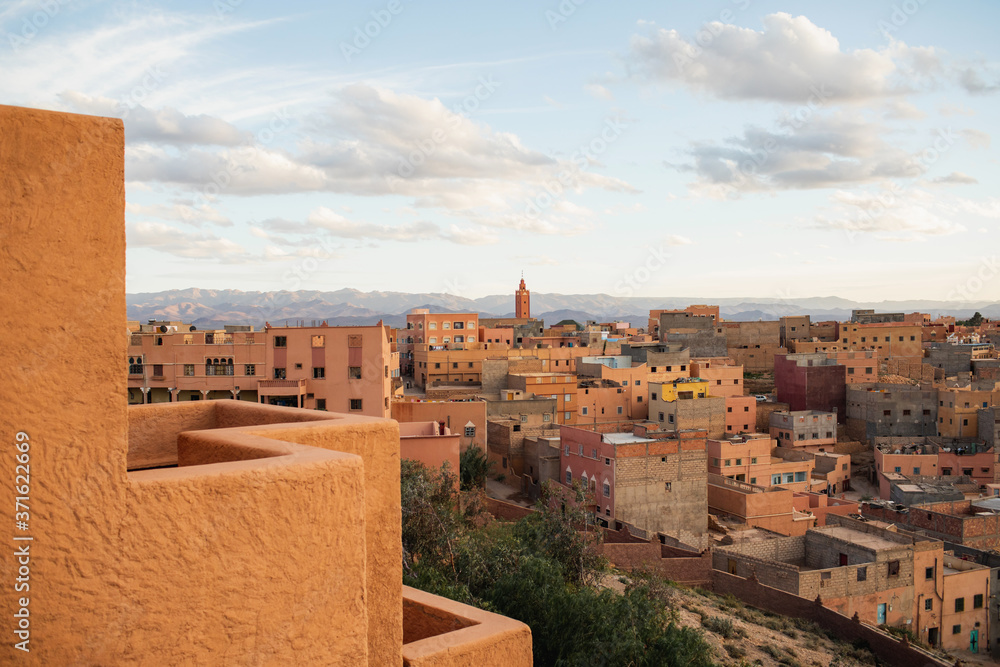 Aerial view of old moroccan town Boumalne at sunset. Traditional style and color of arabian architecture in Morocco.