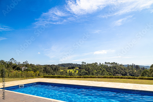 Sunny day by the pool with blue sky