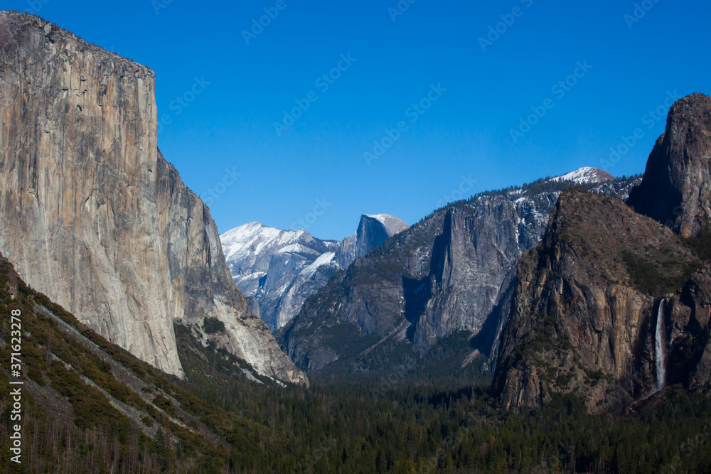 Yosemite Mountains with snow against a blue sky