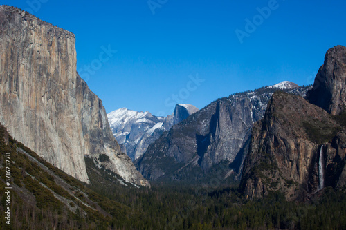 Yosemite Mountains with snow against a blue sky