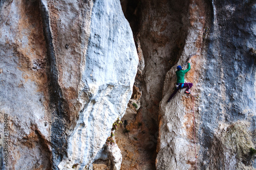 A rock climber on a rock.