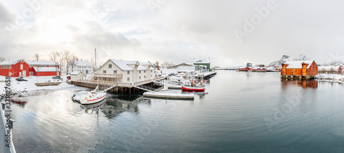 Svinoya Svolvaer village in Norway on Lofoten islands on March, early spring in Northern climate conditions. Living over Polar Circle. Panoramic view of bay, Norwegian wooden traditional architecture. photo