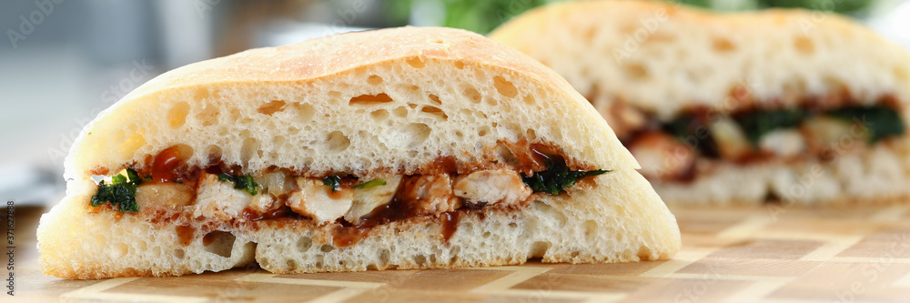 Close-up of delicious sandwiches with mixed stuffing. Fast food and calories. Unhealthy eating. Yummy brunch with fresh bread. Quick lunch and break from work concept Close-up of delicious sandwiches with mixed stuffing. Fast food and calories. Unhealthy eating. Yummy brunch with fresh bread. Quick lunch and break from work concept