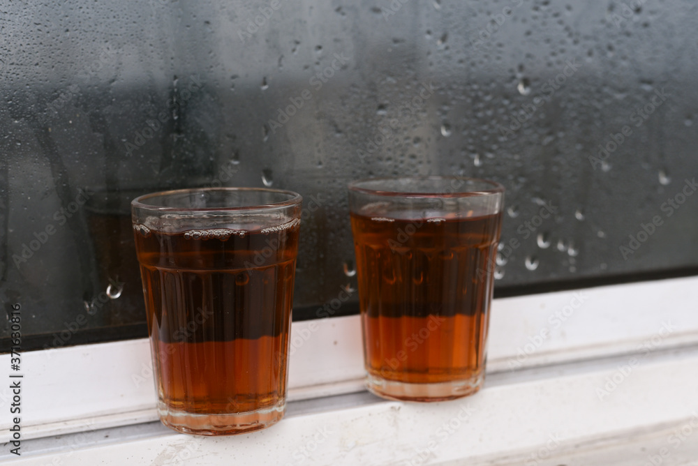Indian Masala Chai black tea, traditional beverage with or without milk and spices Kerala India. Two cups of organic ayurvedic or herbal drink India, good in winter for immunity boosting. Indian Masala Chai black tea, traditional beverage with or without milk and spices Kerala India. Two cups of organic ayurvedic or herbal drink India, good in winter for immunity boosting.