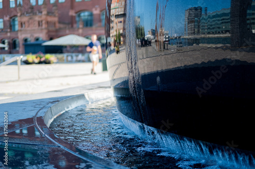 Urban weather sculpture with nice reflections.