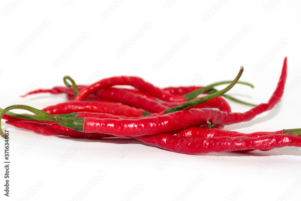 red chilies on a plate with a white background