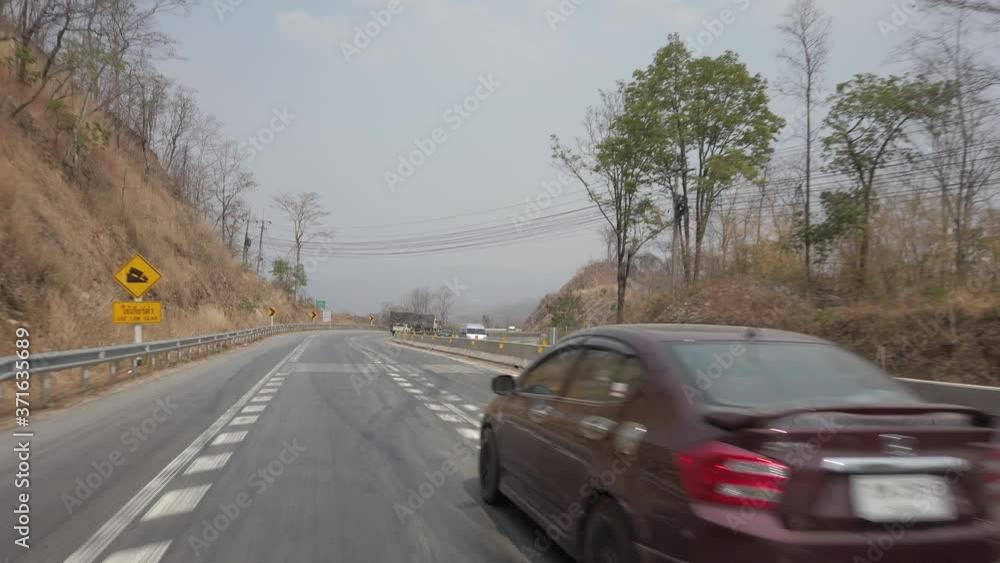 Driving along a mountine road while dry and smog season in Thailand. POV driving footage 4K Driving along a mountine road while dry and smog season in Thailand. POV driving footage 4K