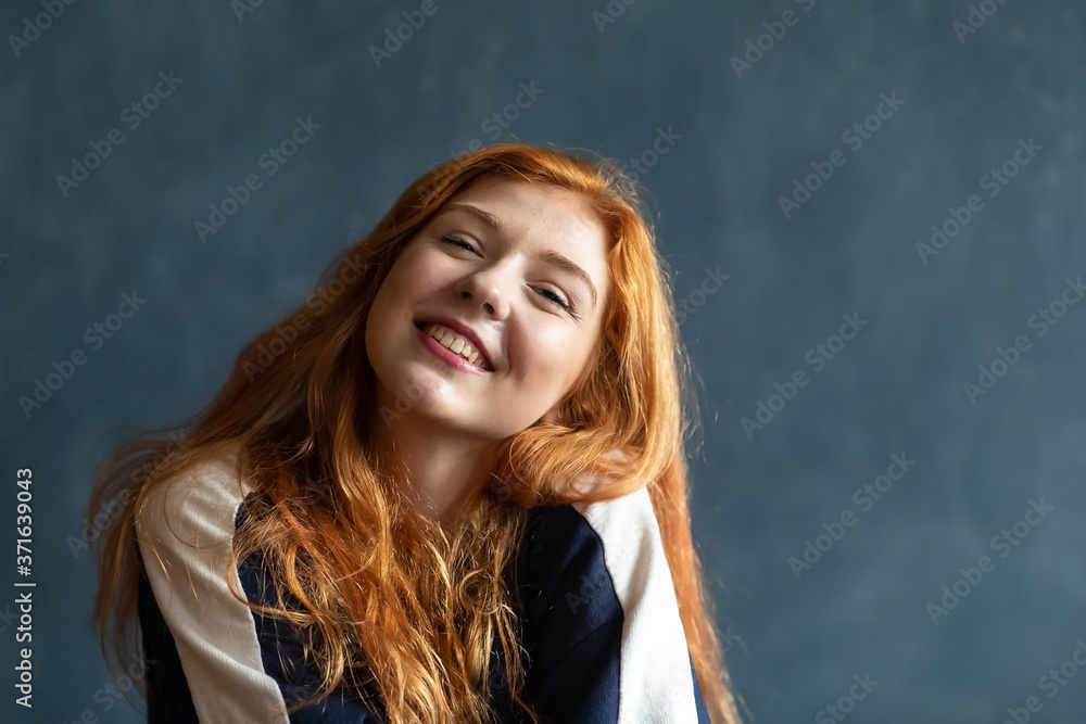 Beautiful woman portrait on blue background with emotions Beautiful woman portrait on blue background with emotions