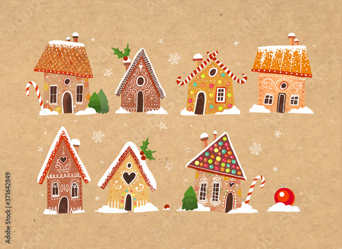 Set of cute gingerbread houses with christmas decorations on craft paper background