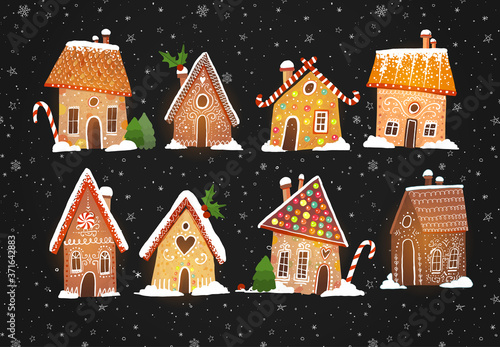 Set of cute gingerbread houses with christmas decorations on black backrground