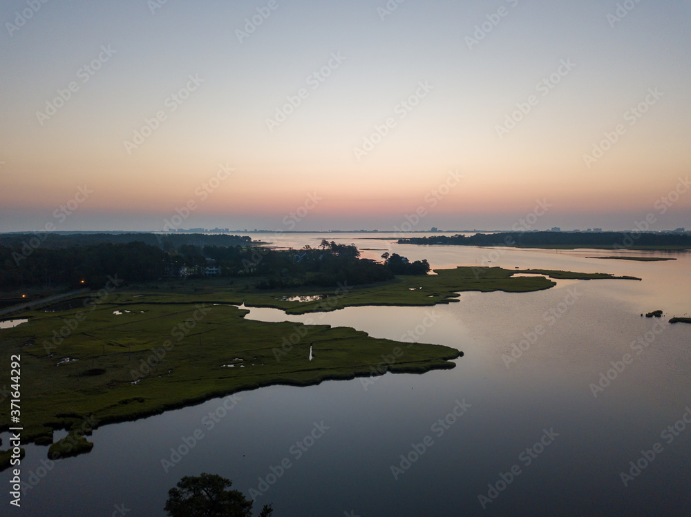 Aerial view of tidal marsh lands at dawn. Aerial view of tidal marsh lands at dawn.