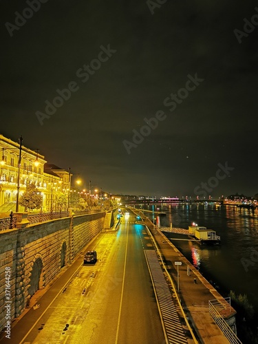 Canvas Print Evening view of The Corvinus University of Budapest with the Danube and the quay