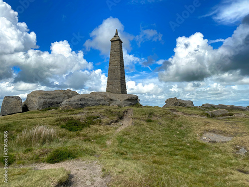 Cowling Pinnacle, with broken cloud, on a summers afternoon in, Cowling, Keighley, UK