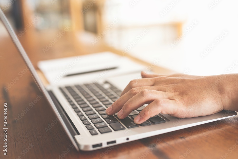man typing on laptop man typing on laptop