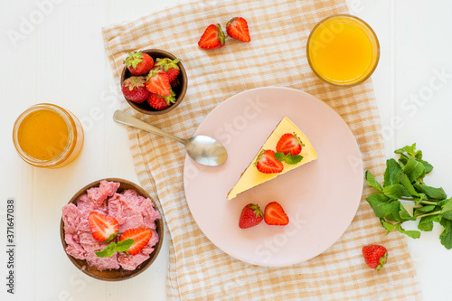 cheesecake with strawberries and pink ice cream, homemade dessert