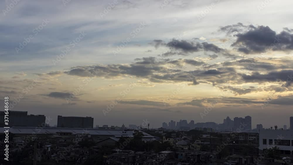 Timelapse view of sky, clouds moving and fading while dusk spreading in to the whole city until its dark Timelapse view of sky, clouds moving and fading while dusk spreading in to the whole city until its dark